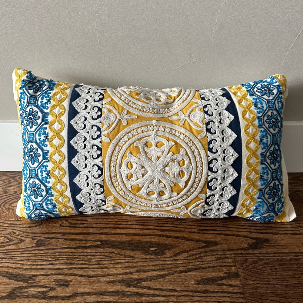 Blue, yellow, and white pillow
